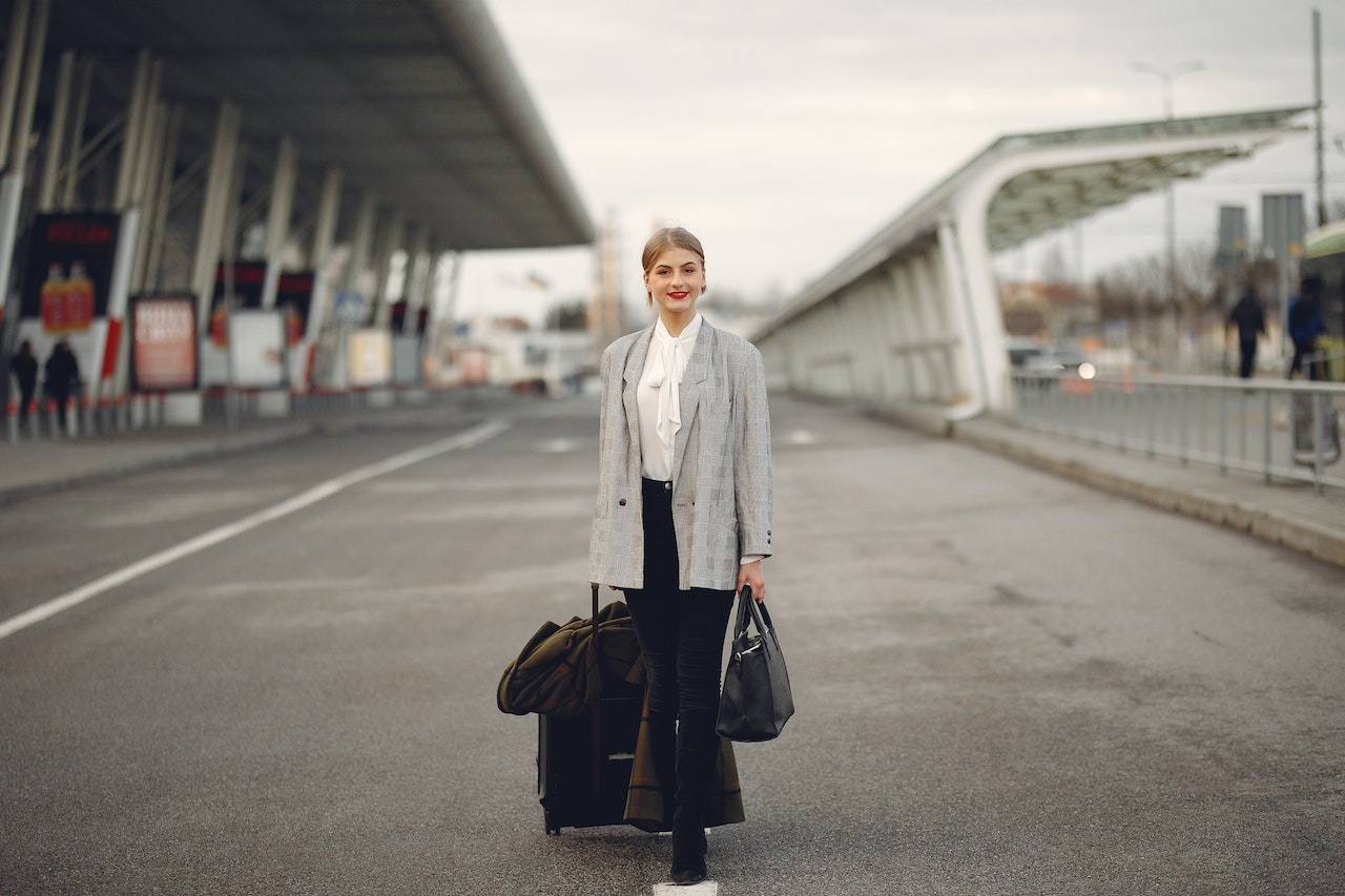 woman in airport with luggage