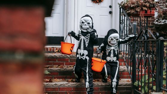 Anonymous kids in Halloween costumes trick or treating